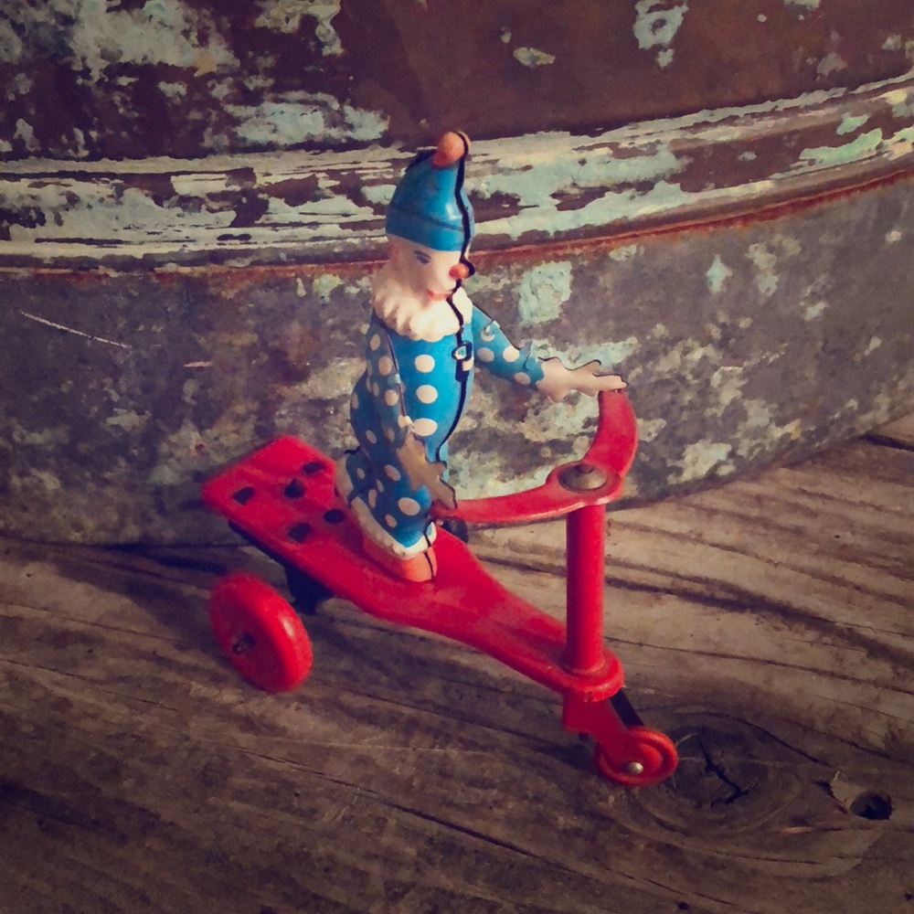 Vintage clown on scooter